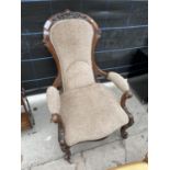 A VICTORIAN WALNUT OPEN ARM EASY CHAIR