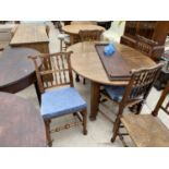 AN EDWARDIAN OAK WIND-OUT DINING TABLE AND FOUR LANCASHIRE STYLE CHAIRS