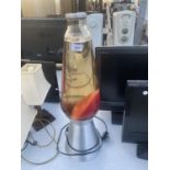 A HUGE DECORATIVE LAVA LAMP BELIEVED IN WORKING ORDER BUT NO WARRANTY