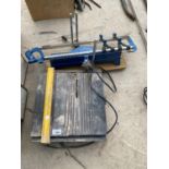 A MITRE SAW AND AN ELECTRIC TILE CUTTER