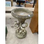 A STONE EFFECT DECORATIVE BIRD BATH WITH CHERUB DESIGN