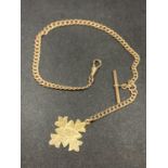 A 9 CARAT GOLD ALBERT CHAIN WITH T BAR AND AN ORNATE CROSS FOB - LENGTH 36 CM, GROSS WEIGHT 39 GRAMS