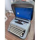 A BROTHER DELUXE TYPE WRITER IN CARRY CASE