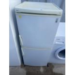 A WHITE ELAN UPRIGHT FRIDGE FREEZER BELIEVED IN WORKING ORDER BUT NO WARRANTY