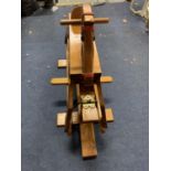 A CHILD'S WOODEN ROCKING HORSE