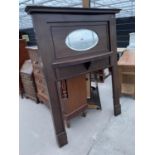 AN EARLY 20TH CENTURY MAHOGANY FIRE SURROUND WITH INSET OVAL BEVEL EDGE MIRROR - 55" WIDE