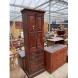 A VICTORIAN PINE TWO DOOR CABINET ENCLOSING FOUR SHORT AND TWO LONG DRAWERS, 27" WIDE