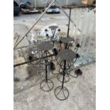 A LARGE QUANTITY OF DECORATIVE METAL CANDLE HOLDERS