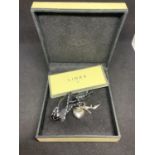 TWO LINKS OF LONDON CHARMS TO INCLUDE A HEART AND A SHOE IN A PRESENTAION BOX