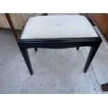 A MODERN EBONISED DRESSING STOOL