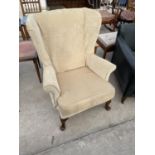 A PARKER KNOLL WINGED CHAIR ON CABRIOLE LEGS, MODEL PK.720 MK111