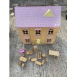 A CHILDRENS WOODEN DOLLS HOUSE WITH A LARGE SELECTION OF WOODEN DOLLS FURNITURE