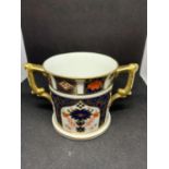 A ROYAL CROWN DERBY TWIN HANDLED CUP 7.5CM TALL