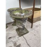 A PAIR OF DECORATIVE STONE EFFECT PLANTERS