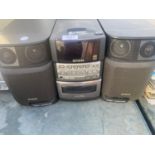 AN AIWA HI-FI SYSTEM WITH SPEAKERS BELIEVED IN WORKING ORDER BUT NO WARRANTY