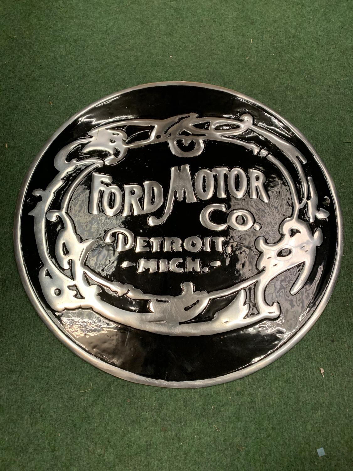 A 'FORD MOTOR COMPANY' BLACK AND SILVER METAL SIGN (D: 49.5CM)