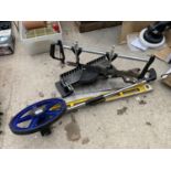 AN ASSORTMENT OF TOOLS TO INCLUDE A MITRE SAW, A MEASURING WHEEL AND A SPIRIT LEVEL ETC