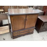 A MAHOGANY AND INLAID TV CABINET