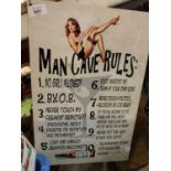 A VINTAGE STYLE METAL 'MAN CAVE RULES' SIGN