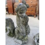 A STONE EFFECT CHERUB HOLDING A FISH TO ALSO BE USED AS A WATER FEATURE