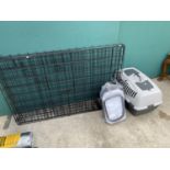 A LARGE PET CRATE AND A FURTHER PET AIRLINE CARRIER WITH BEDDING
