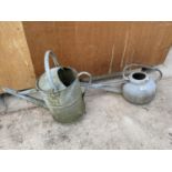 TWO VINTAGE METAL WATERING CANS