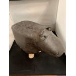 A FAUX LEATHER CHILD'S FOOTSTOOL IN THE FORM OF A HIPPOPOTAMUS