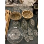 A SELECTION OF GLASSWARE TO INCLUDE SEVERAL JELLY MOULDS