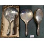 FOUR HALLMARKED ITEMS TO INCLUDE TWO HAND MIRRORS, A BRUSH AND A COMB
