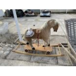 A VINTAGE CHILDRENS ROCKING HORSE