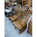 A PAIR OF MODERN ROCKING CHAIRS WITH BENTWOOD ARMS AND HORIZONTAL ROCKING ACTION