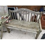 A WOODEN RUNGED GARDEN BENCH