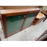 A MAHOGANY TWO DOOR GLAZED WALL CABINET, 48" WIDE