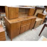 A RETRO NATHAN TEAK SIDEBOARD WITH SIX CUPBOARDS, TWO DRAWERS AND SLIDING GLASS DOORS, 54" WIDE