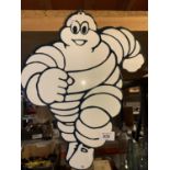 A TIN METAL 'RUNNING MICHELIN MAN' SIGN