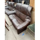 A STRESSLESS BROWN LEATHER TWO SEATER SOFA