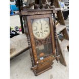 A VINTAGE AND DECORATIVE WALL CLOCK WITH KEY