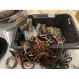 A TUB OF COSTUME JEWELLERY TO INCLUDE BANGLES, NECKLACES ETC