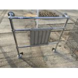 A CAST IRON AND CHROME PLATED RADIATOR/TOWEL RAIL