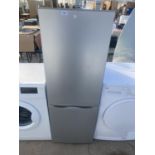 A SILVER UPRIGHT FRIDGE FREEZER BELIEVED IN WORKING ORDER BUT NO WARRANTY