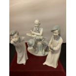 THREE LADRO STYLE FIGURINES TO INCLUDE A GENTLEMAN WITH HIS DOG (HAT A/F), A YOUNG BOY AND A YOUNG