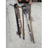 AN ASSORTMENT OF WALKING STICKS TO ALSO INCLUDE A LACROSS STICK AND STICK SEAT ETC