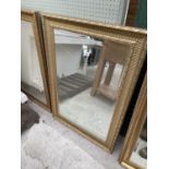 A MODERN GILT FRAMED WALL MIRROR 29.5x42"