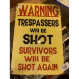 A TIN METAL GARAGE/MAN CAVE SIGN 'TRESPASSERS WILL BE SHOT'