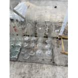 A LARGE QUANTITY OF GLASS VASES TO MAINLY INCLUDE TALL CENTRE PIECE STYLE VASES