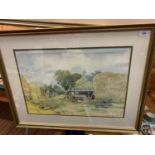 A GILT FRAMED WATERCOLOUR 'FARMYARD' SIGNED P.J. HAUGHTON