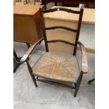 A RUSH SEATED LADDERBACK ELBOW CHAIR