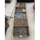 FIVE WOODEN STORAGE BOXES CONTAINING A LARGE QUANTITY OF NAILS