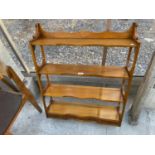 A BEVAN FUNNELL FOUR TIER WALL SHELF WITH THREE DRAWERS TO THE LOWER PORTION