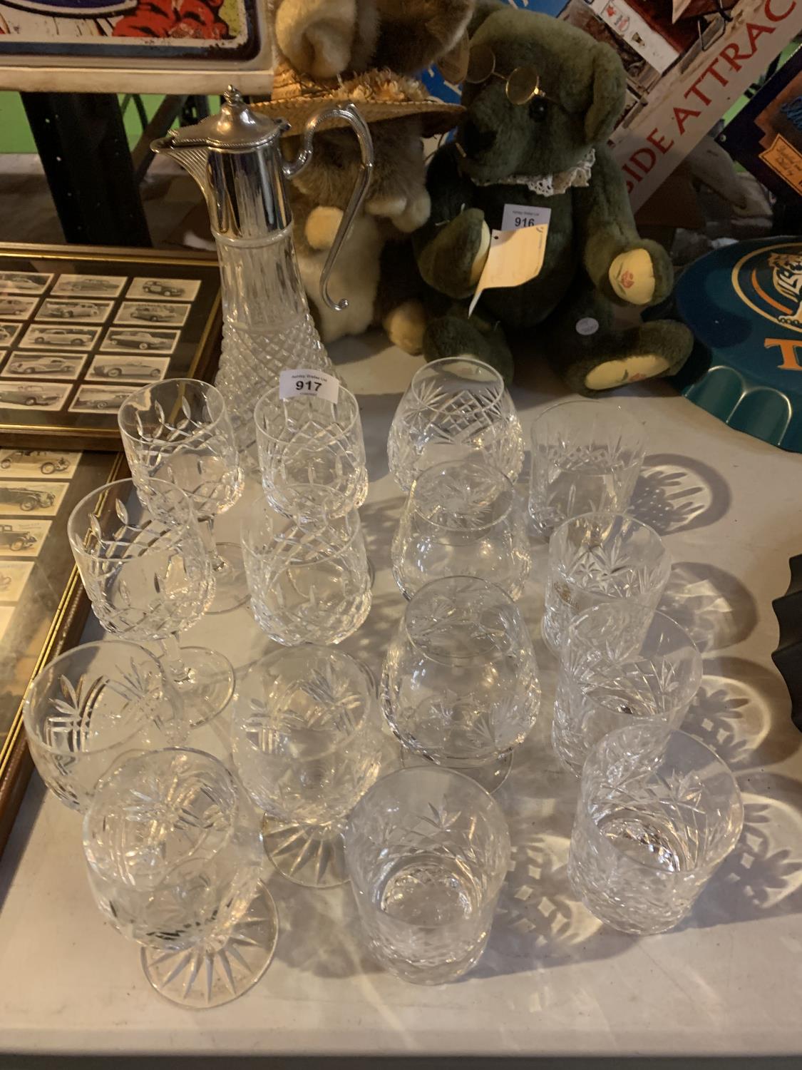 A COLLECTION OF CUT GLASS GLASSES AND A WINE CARAFE